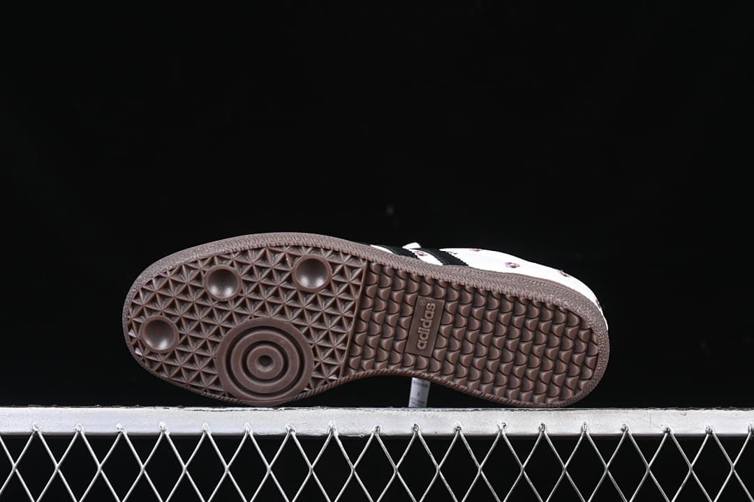 Underside view of the dark brown patterned outsole