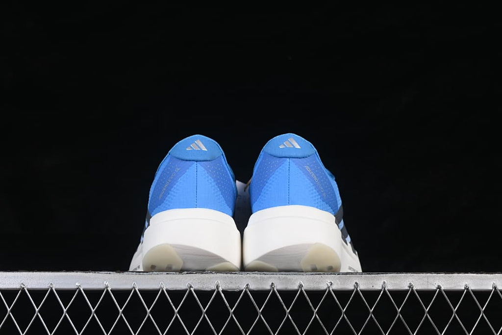 Rear view of the pair highlighting the blue heel panels and white midsoles.
