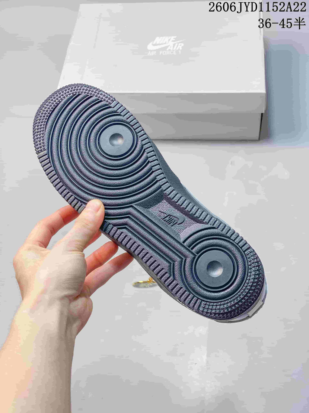Close-up of the sneaker outsole with circular traction patterns