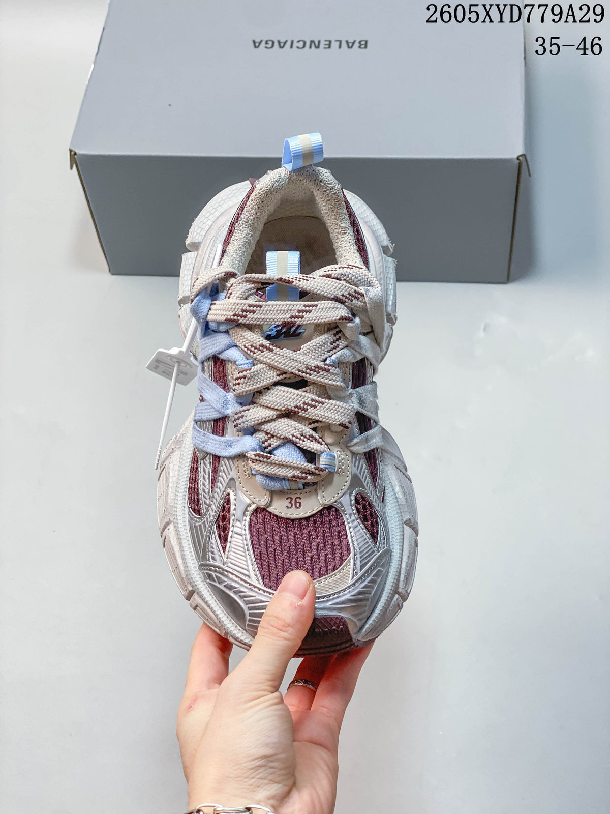Top view of a Balenciaga Phantom sneaker with layered laces and burgundy front panels.