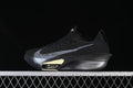 Side view of black Nike Alphafly 3 running shoe with silver Swoosh and pale yellow sole accents