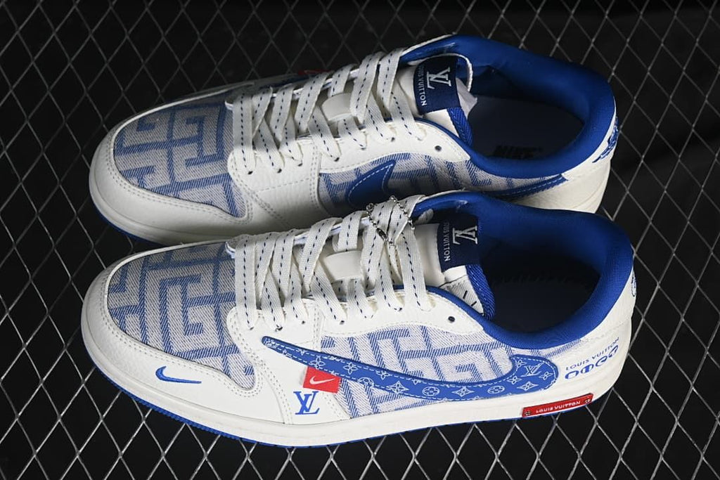 Top view of a pair of white and blue low-top sneakers with patterned panels and blue accents.