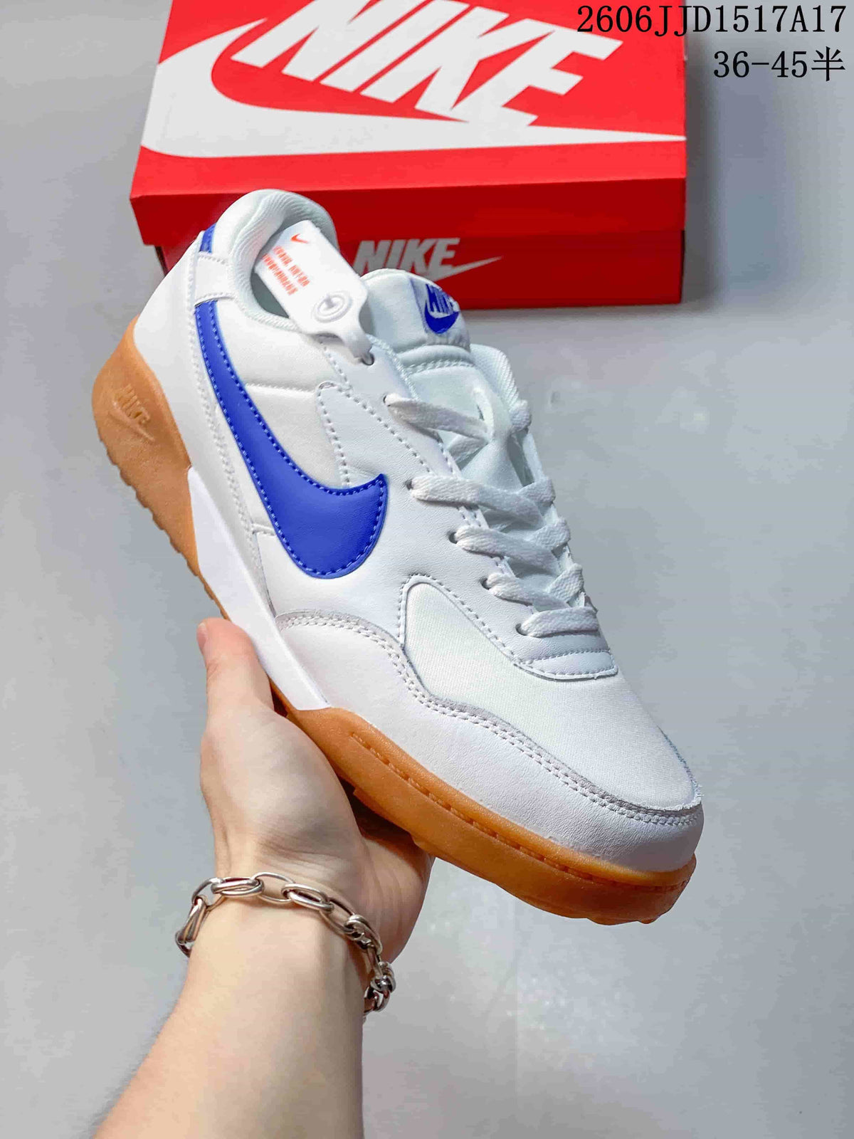 White Nike Terra Manta sneaker with a blue Swoosh and gum-colored outsole
