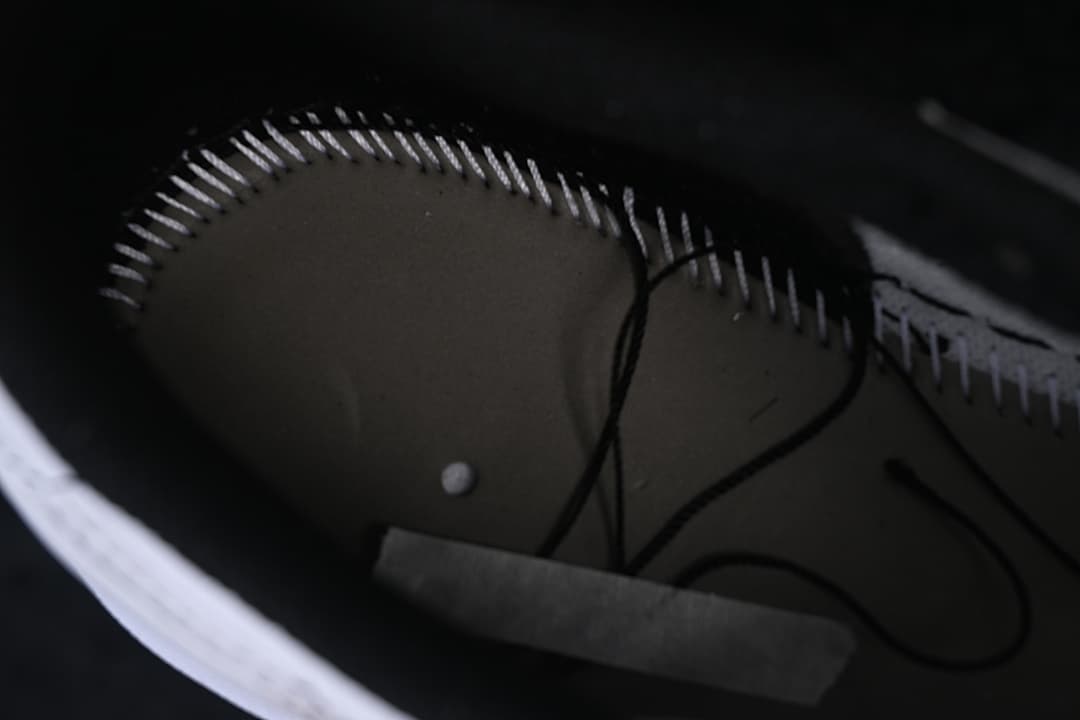 Close-up of interior stitching and lining.