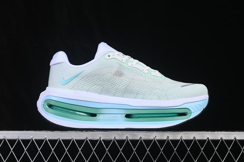 Side profile showing the pale mint mesh-look upper and high-profile midsole