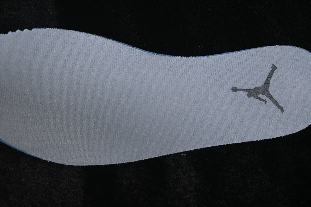 Grey shoe insole with a Jumpman logo.