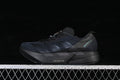 Black adidas Adizero Adios Pro 4 running shoe in side view