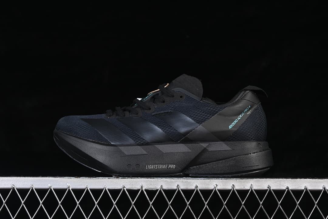 Black adidas Adizero Adios Pro 4 running shoe in side view