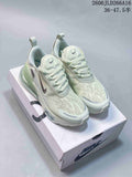 Pair of pale green and off-white Nike Air Max 270 sneakers on a shoebox
