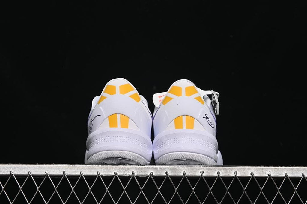 Rear view of the pair showing yellow heel accents
