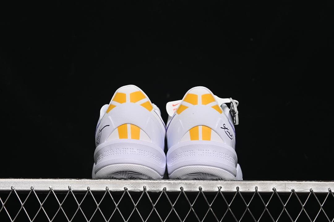 Rear view of the pair showing yellow heel accents