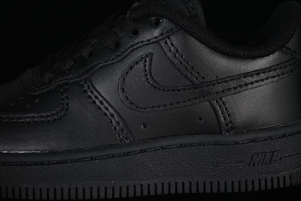 Close-up of the black side panel, Swoosh and outsole