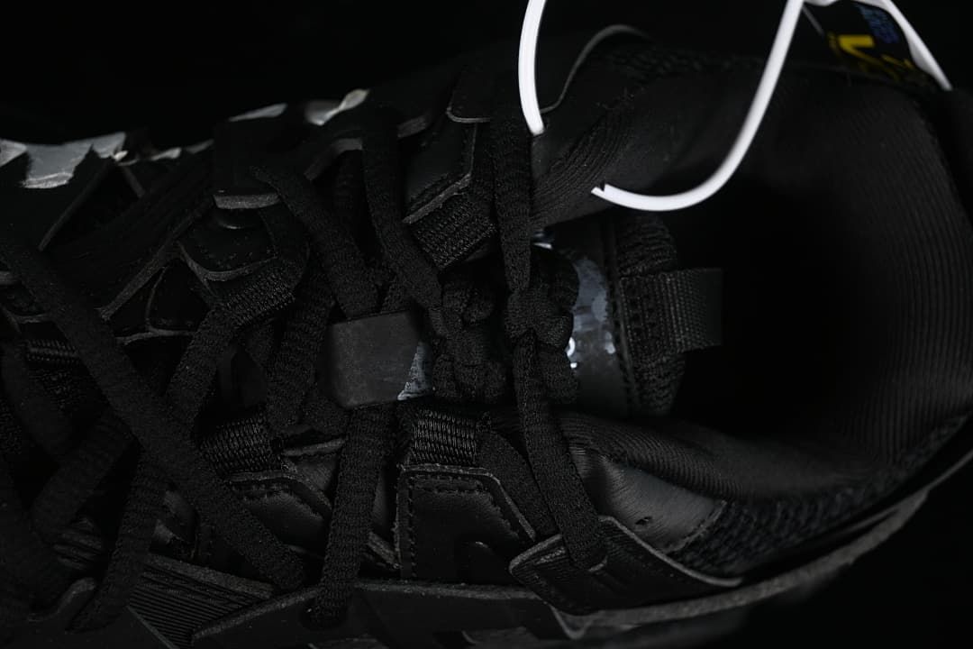 Top-down detail of black laces and the shoe interior.