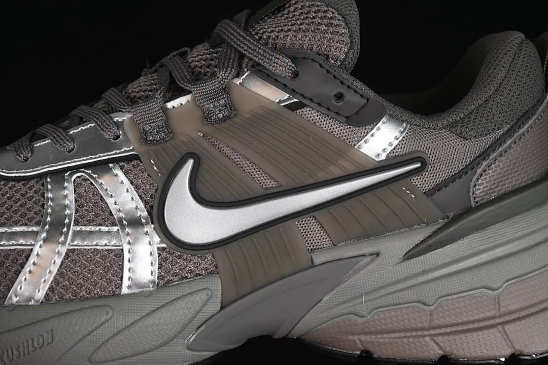 Close-up of the side swoosh, mesh panels, and layered overlays