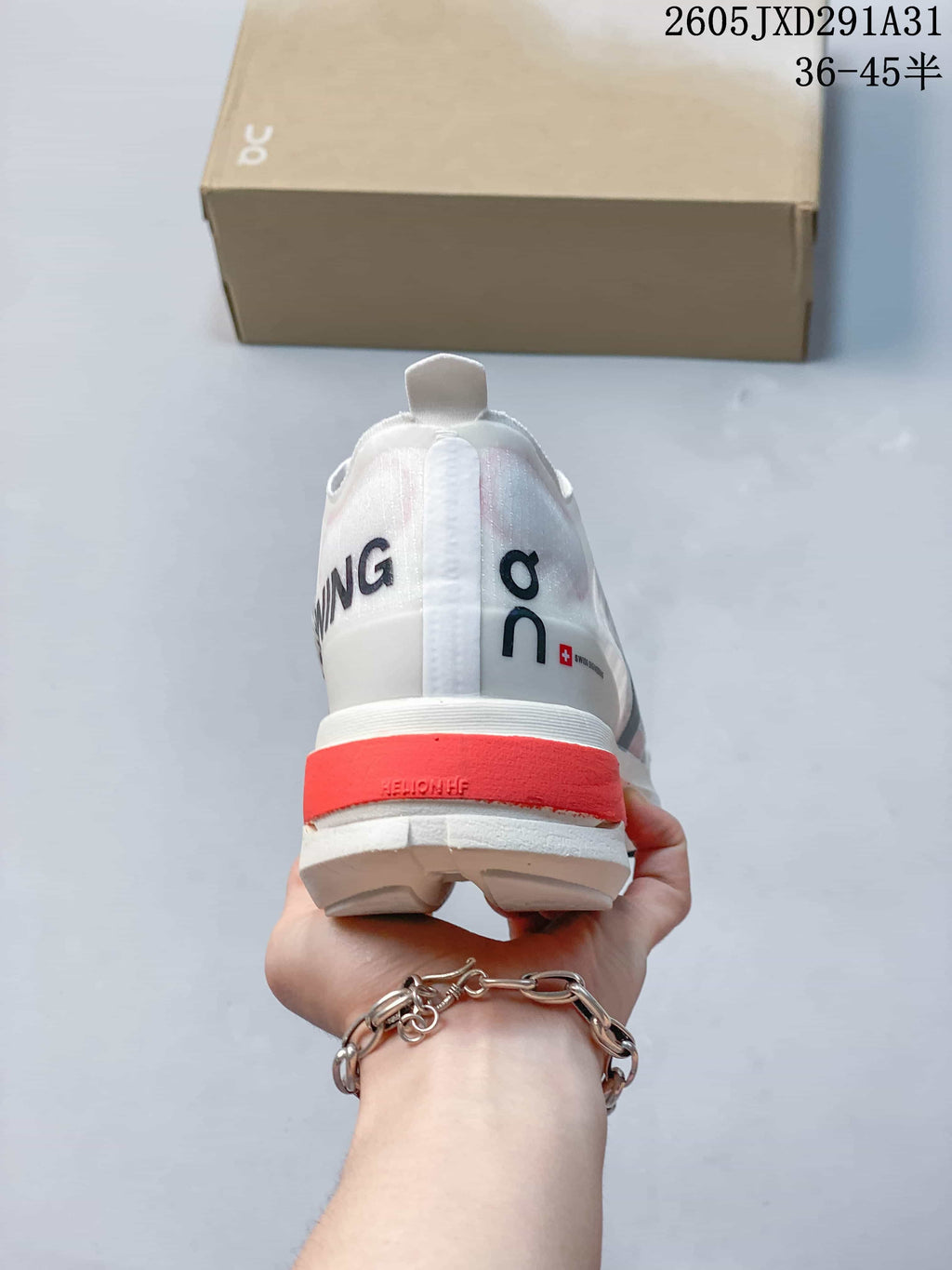 Rear view of the shoe with a coral-colored heel section