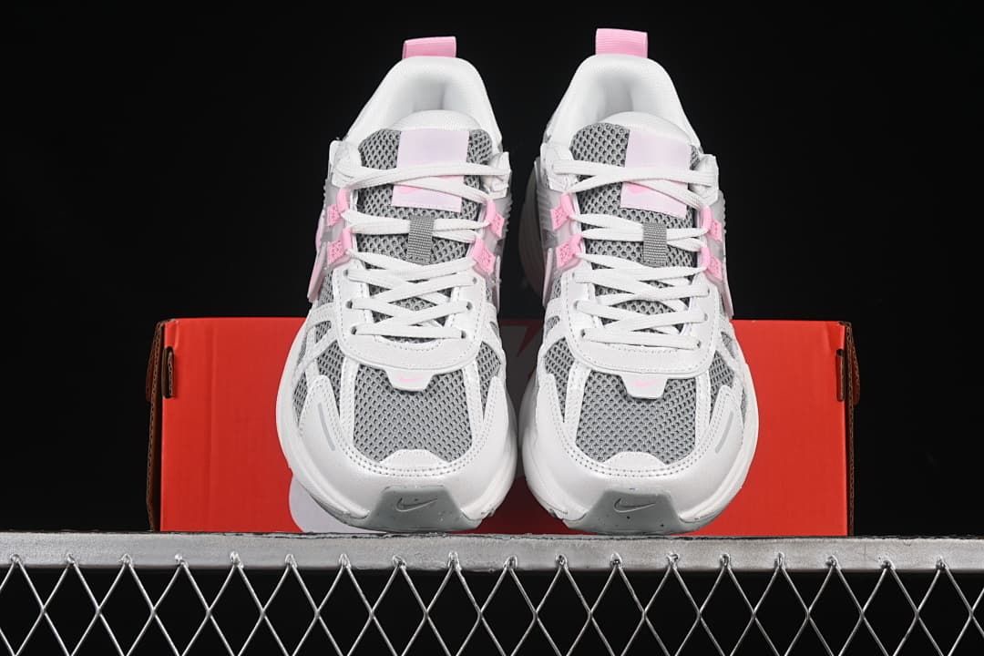 Front view of the pair showing gray mesh-look toe panels and pink accents