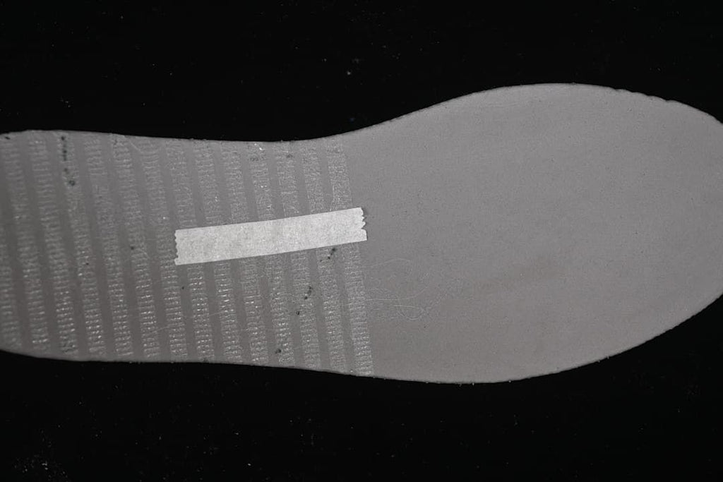 Close-up of the light-colored shoe outsole