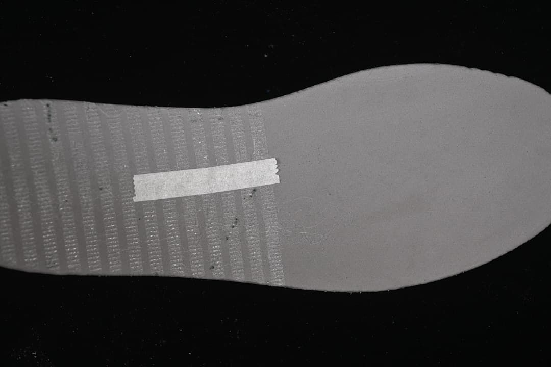 Close-up of the light-colored shoe outsole