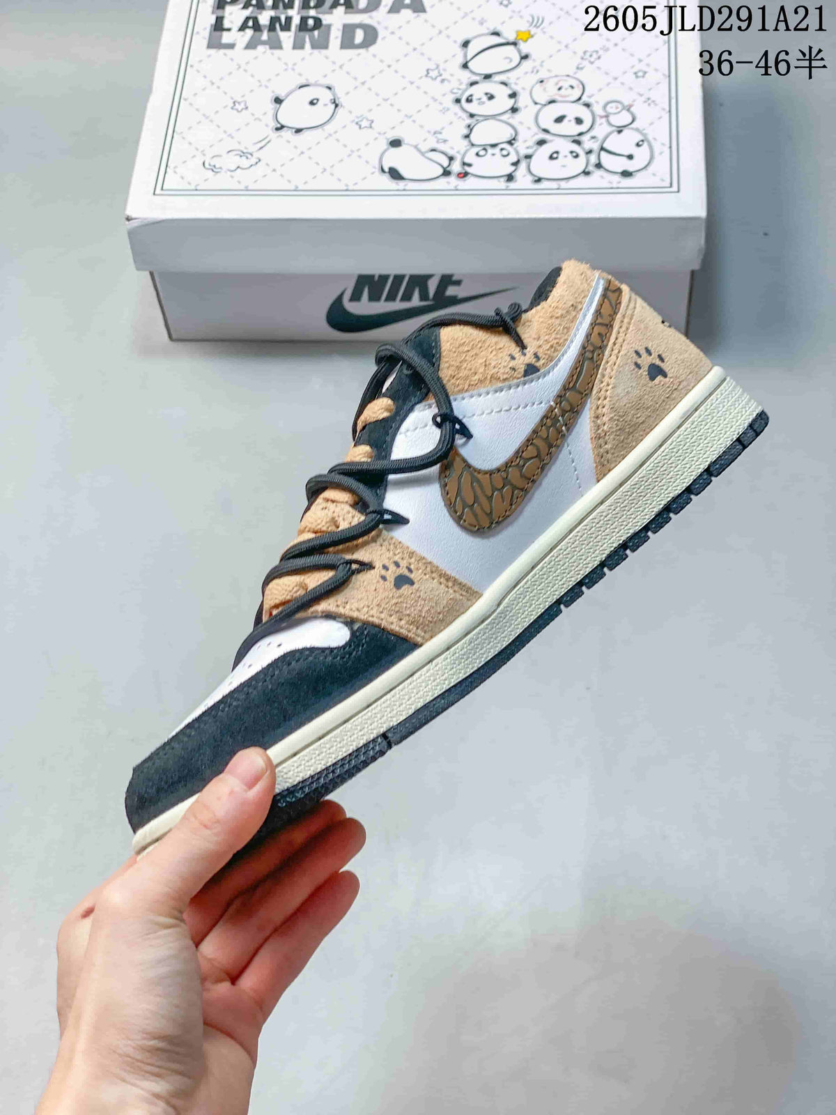 Side view of a low-top sneaker with a patterned Swoosh and tan overlays