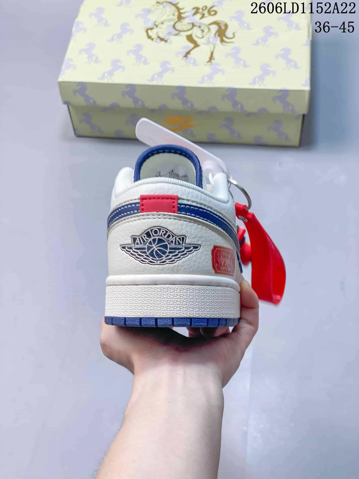 Rear view showing the heel branding and blue outsole edge