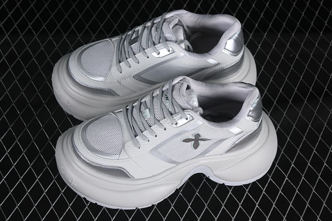Pair of gray-and-silver low-top sneakers shown from above