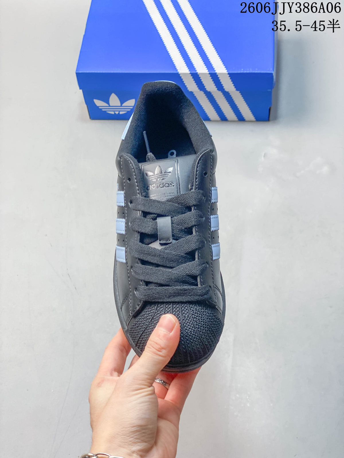 Front view showing the shell toe and laces of an adidas Superstar 2 sneaker