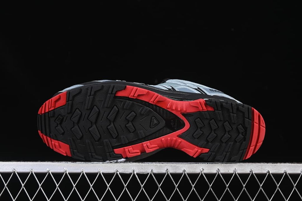 Underside showing the black and red patterned outsole