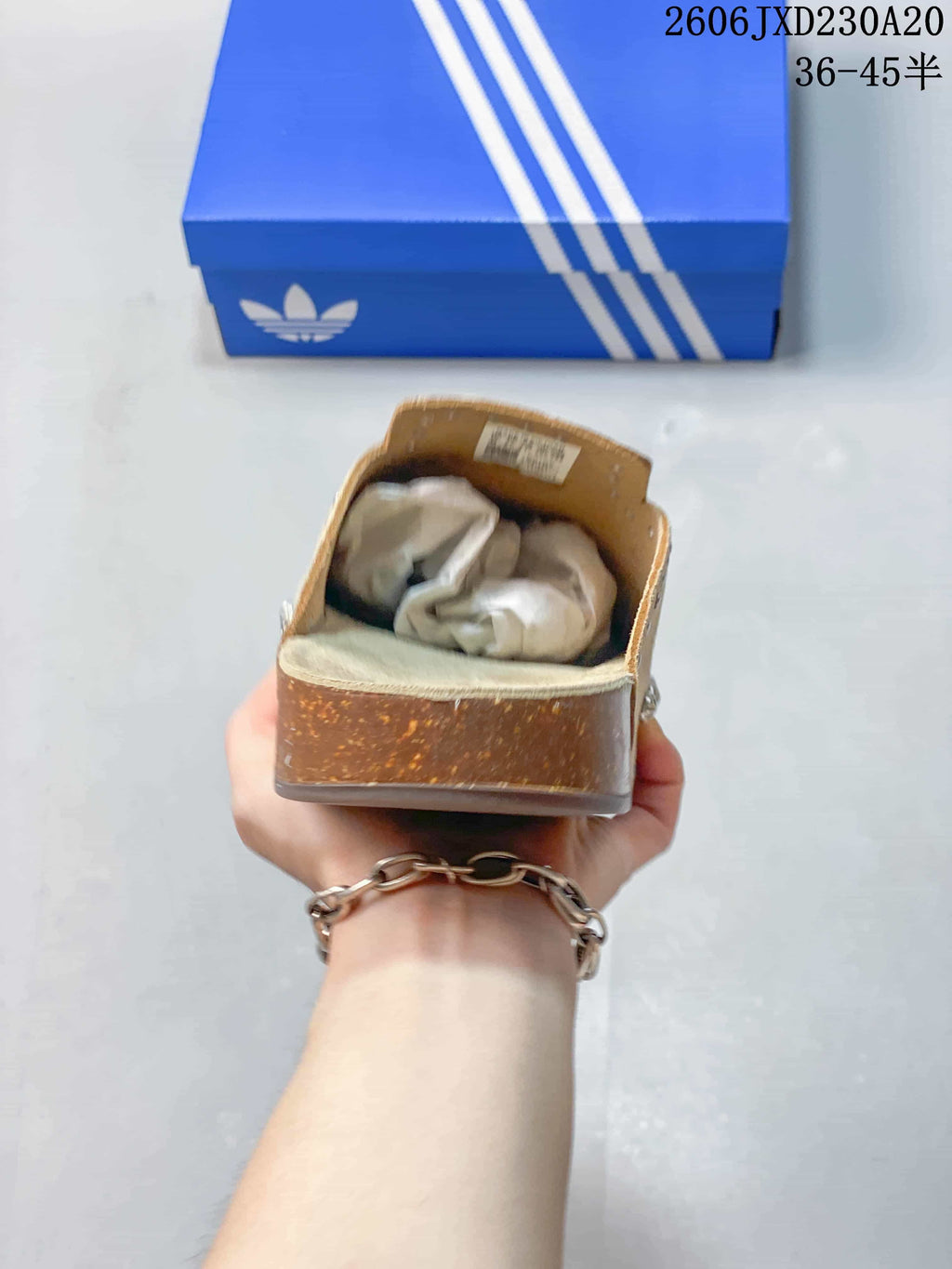 Rear view of a tan adidas Adimule mule slide