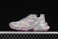 Side view of a beige and gray Balenciaga Runner 2 Nylon sneaker with pink and yellow accents.