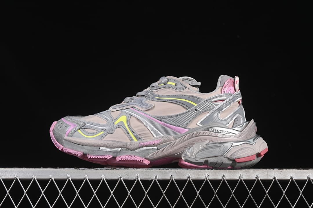 Side view of a beige and gray Balenciaga Runner 2 Nylon sneaker with pink and yellow accents.