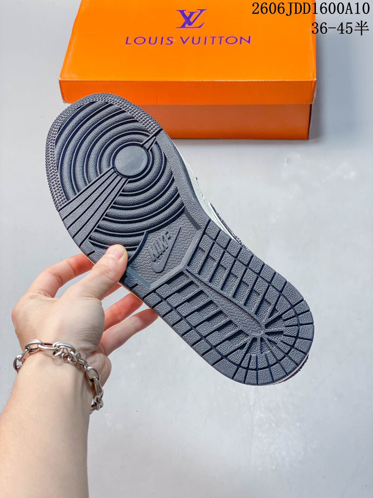 Close-up of the sneaker's dark outsole with circular tread pattern