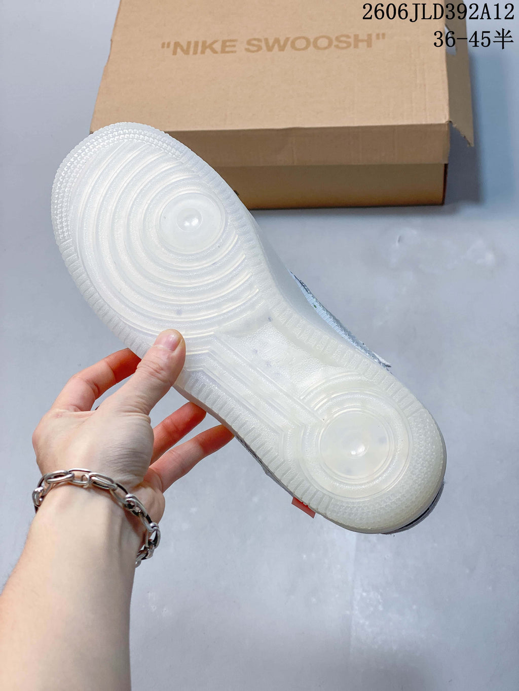 View of the translucent-looking outsole of a white low-top sneaker