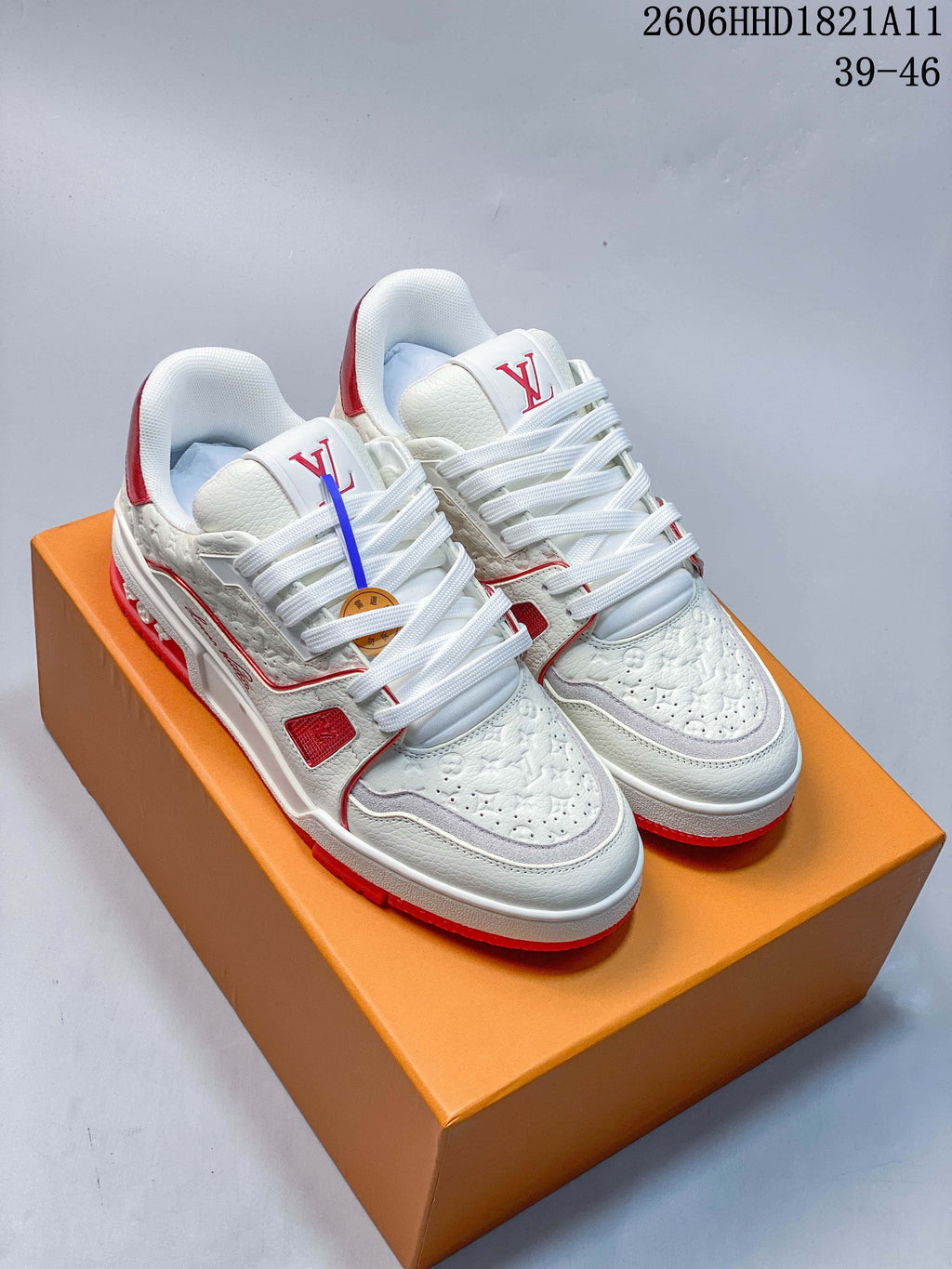 White and red Louis Vuitton Trainer-style low-top sneakers shown from above, with size range 39–46 printed in the image.