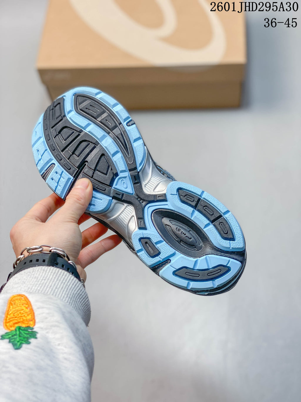 Outsole view showing the blue and dark gray tread