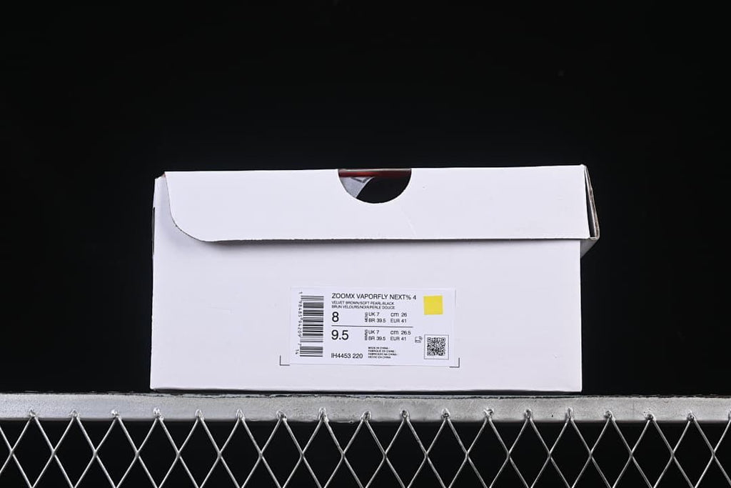 Shoe box label identifying ZoomX Vaporfly NEXT% 4 and style code IH4453-220, with sample size markings.