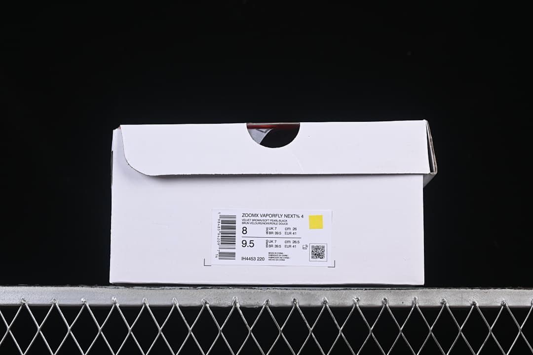 Shoe box label identifying ZoomX Vaporfly NEXT% 4 and style code IH4453-220, with sample size markings.