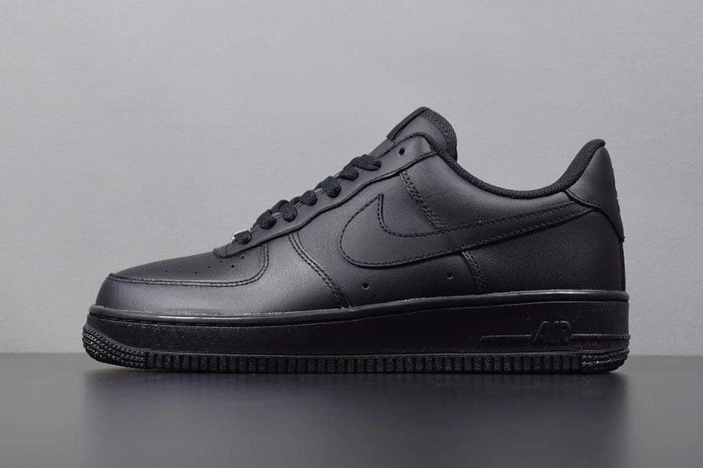 Side view of an all-black Nike Air Force 1 Low sneaker
