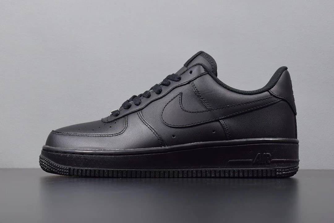 Side view of an all-black Nike Air Force 1 Low sneaker