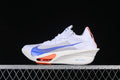 Side view of a white Nike ZoomX Vaporfly 3 running shoe with blue Swoosh and orange accents
