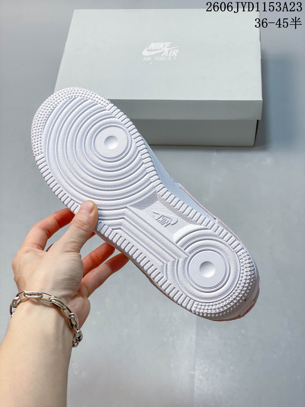 Close-up of the white sneaker outsole and circular tread pattern