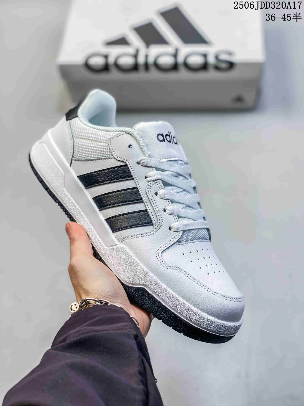 White adidas Entrap sneaker with black side stripes and a dark outsole