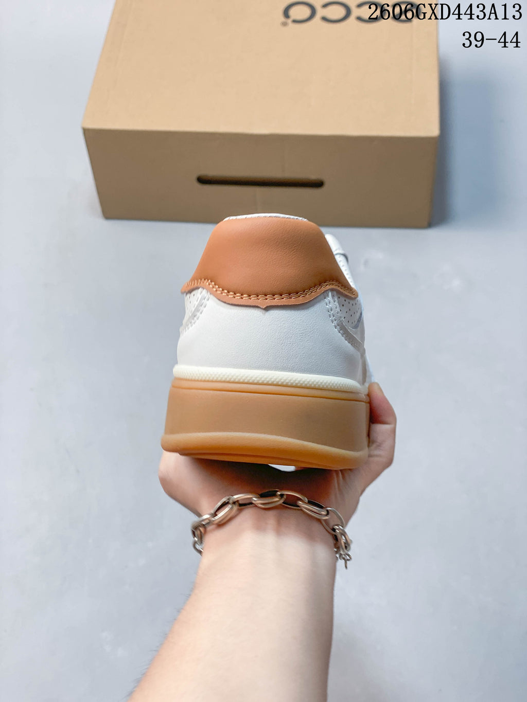 Rear view showing the tan heel accent and gum-colored sole.
