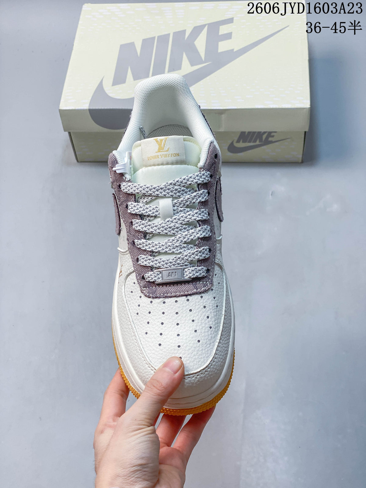 Top view showing the perforated toe, contrast laces, and mauve lace panel