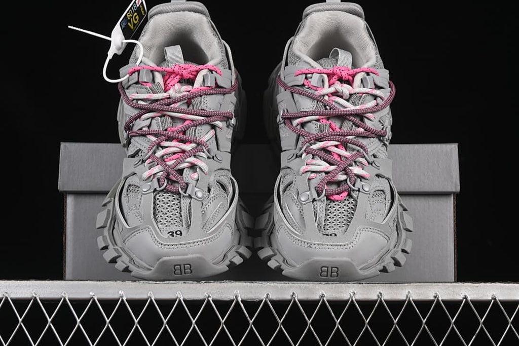 Pair of grey Track sneakers viewed from the front
