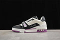 White, black, and purple low-top LV Trainer-style sneaker shown in side profile