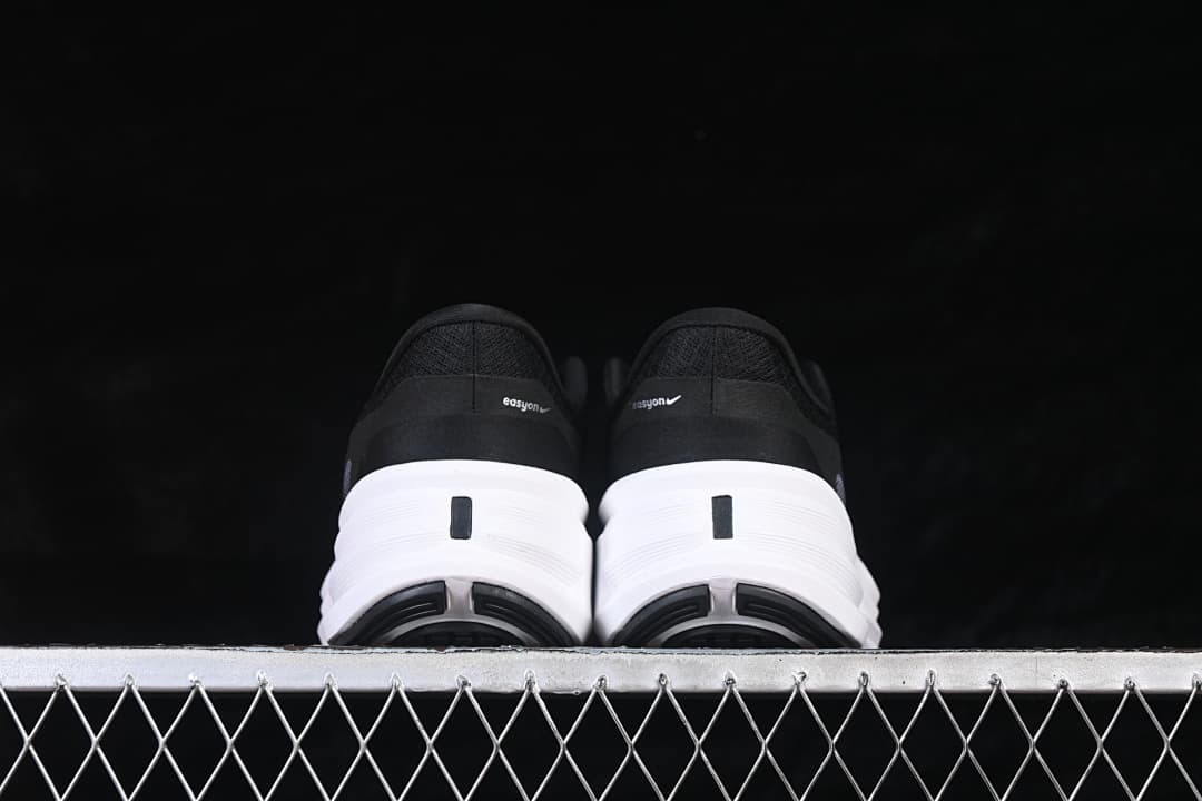 Rear view of both shoes showing the heel panels and white midsoles.