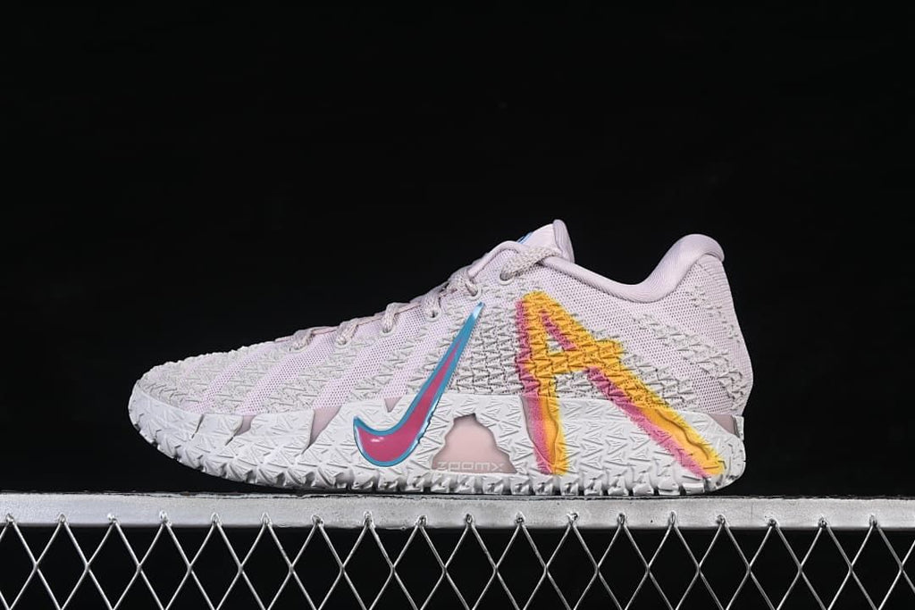 Side view of the shoe showing a multicolor graphic and blue-outlined swoosh