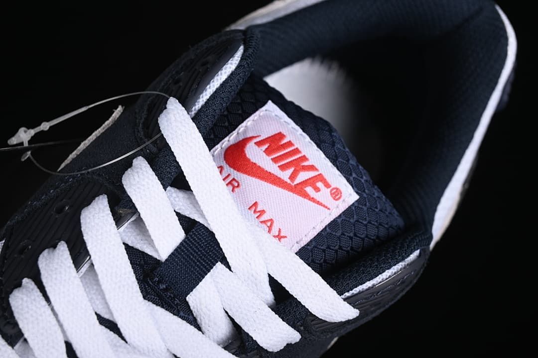 Close-up of white laces and tongue branding