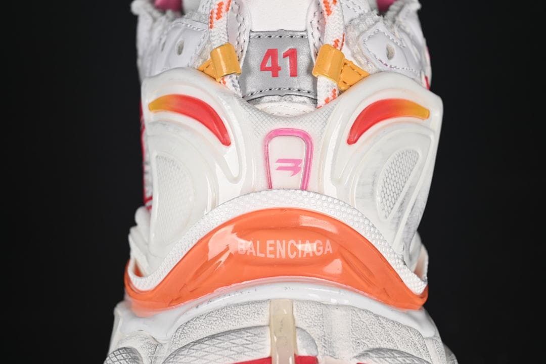 Rear close-up of the sneaker with orange and red heel details