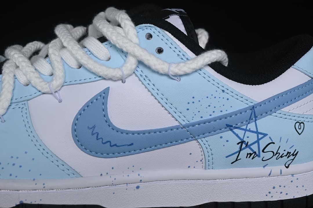 Close-up of blue overlays, Swoosh, side graphics, and oversized rope laces